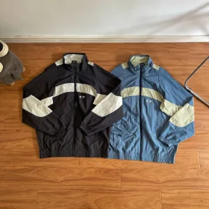 High Quality Oakley Outerwear Blue Nylon Woven Fabric Relaxed Fit Outdoor Windproof Lightweight Retro Patchwork Patch